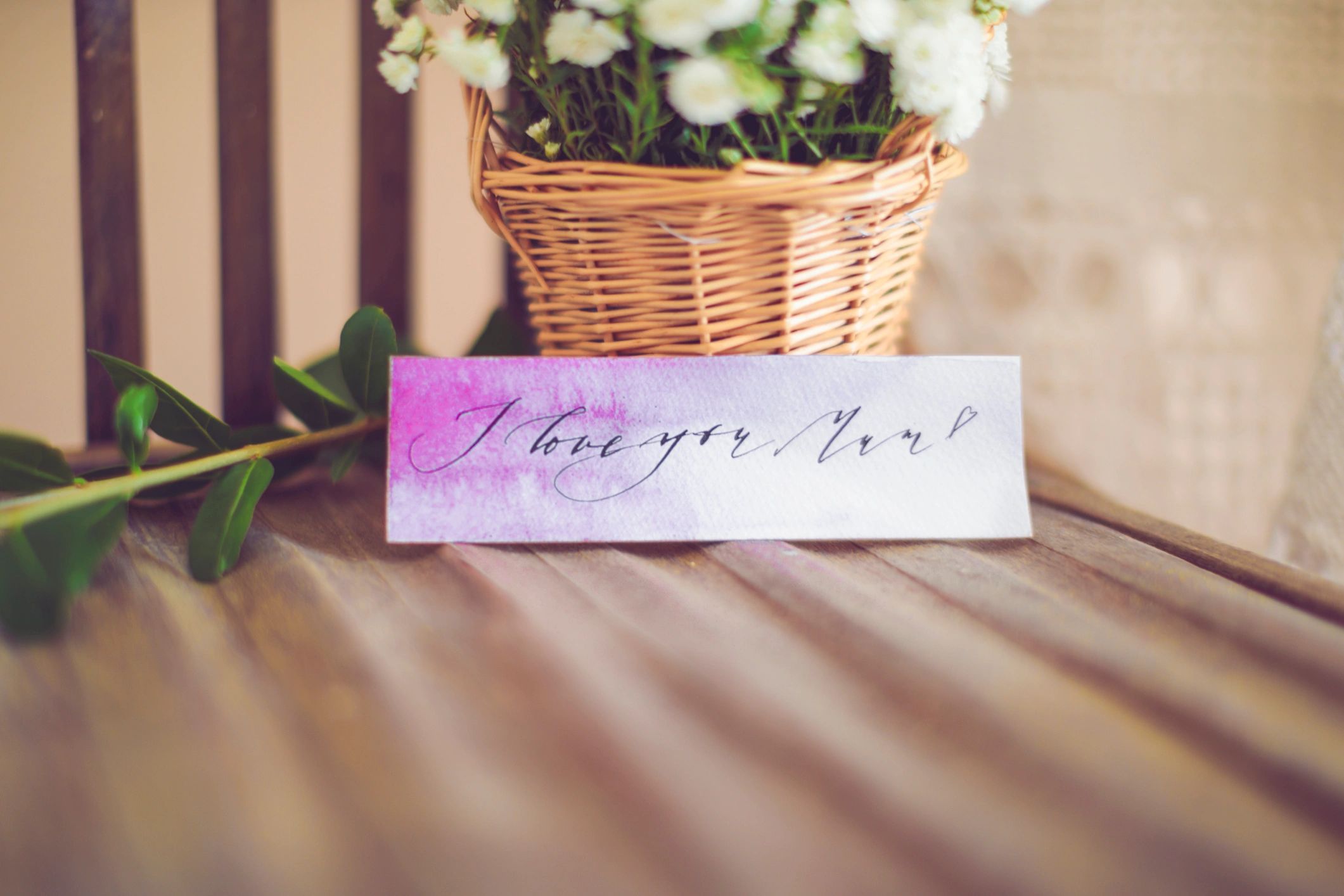 Handwritten encouragement note beside a thoughtful gift